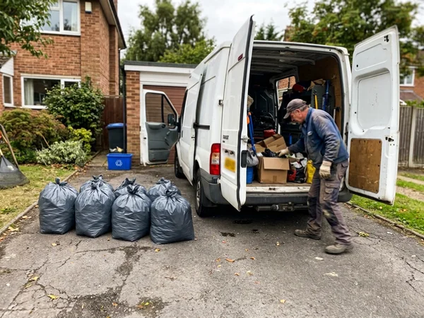 Sealed waste bags staged for disposal